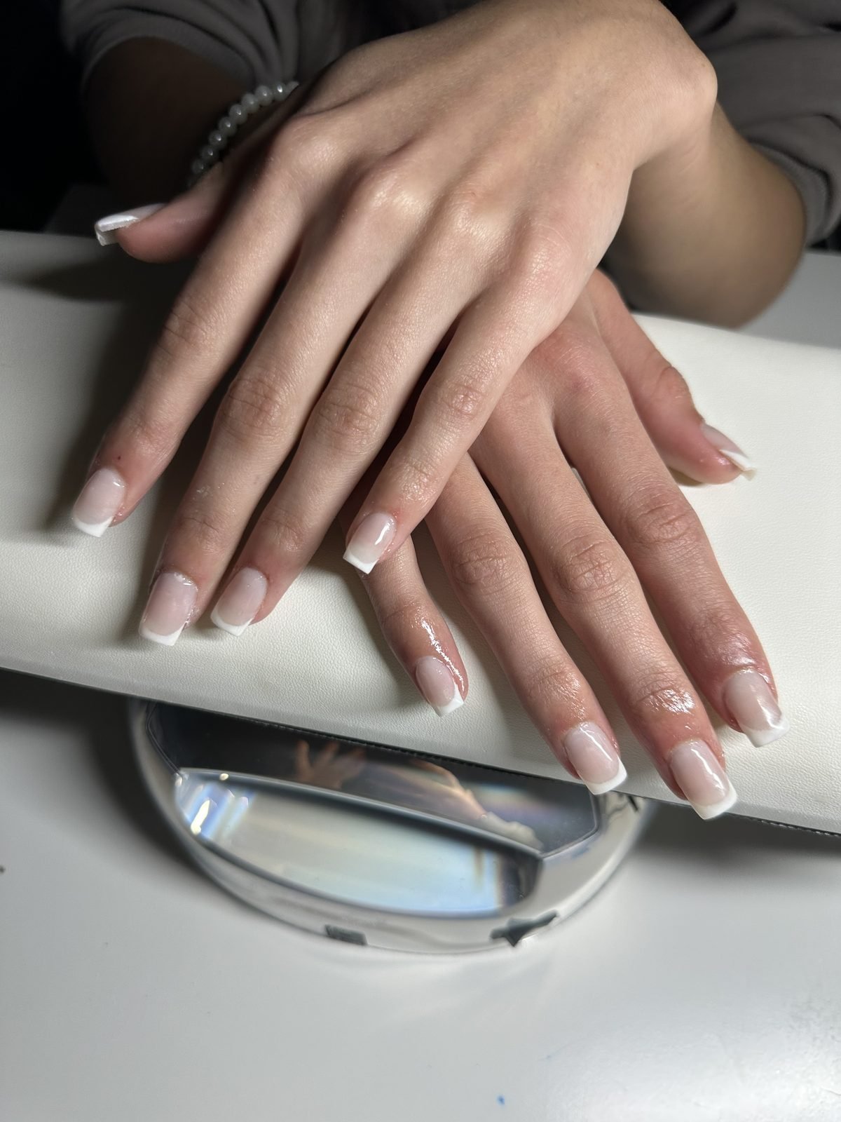 Classic white French acrylic set with a high-gloss finish